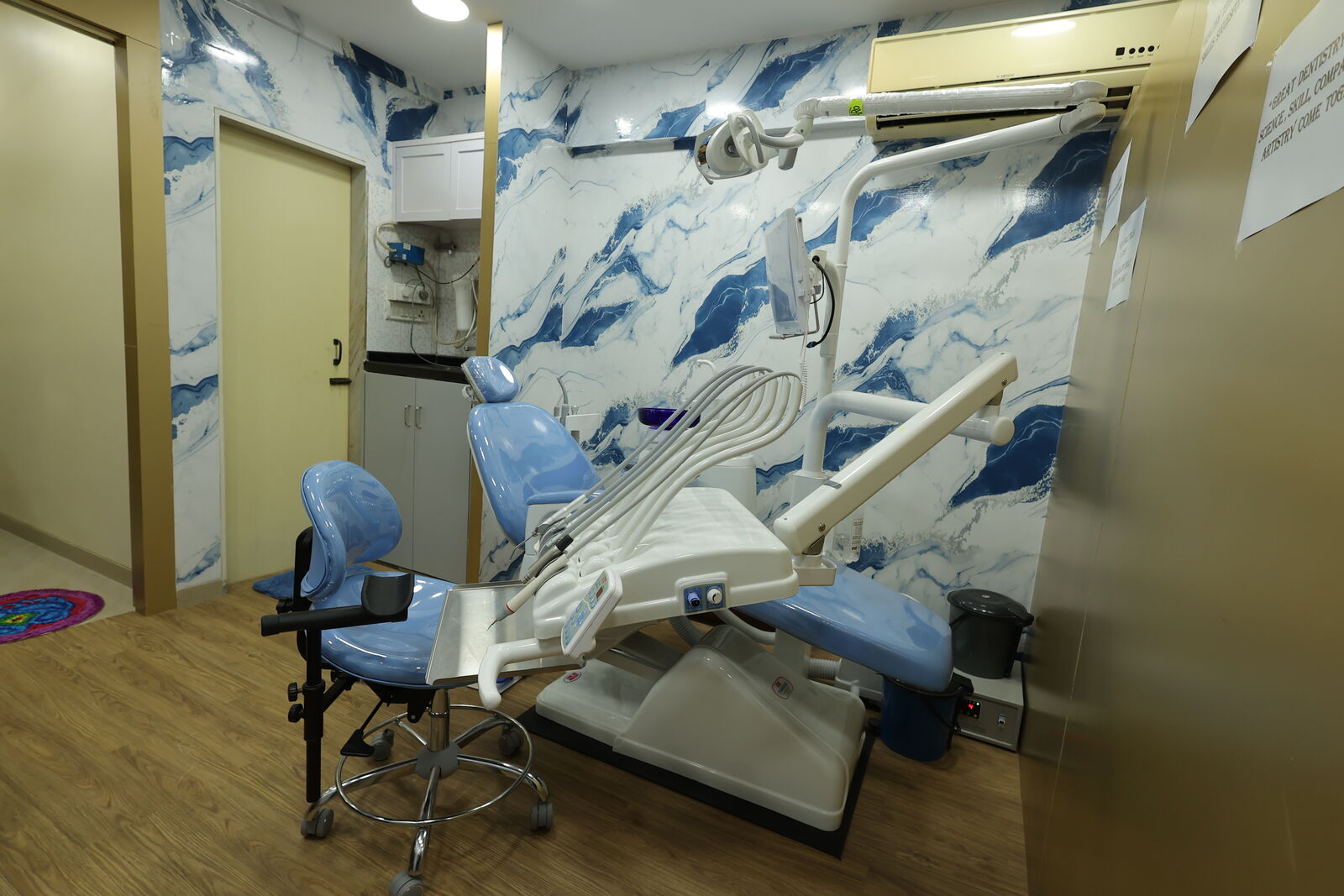 Dental treatment chair with chairside X-ray arm at Srinidhi Dental & Implant Clinic